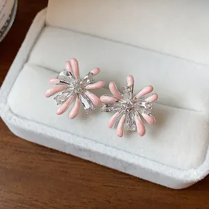 Close-up of pink enamel firework stud earrings with sparkling cubic zirconia stones