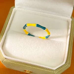 Detailed view of the colorful enamel bamboo joint open ring in a premium velvet box