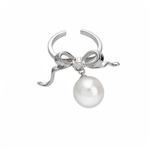 Elegant silver open ring featuring a zircon bow design and a graceful dangling white pearl