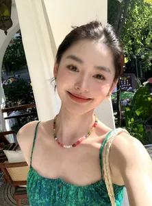 Asian model wearing a colorful candy-colored pearl and crystal beaded necklace set