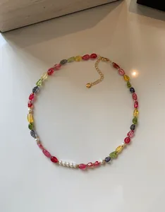 Detailed view of colorful dopamine-style beaded necklace with pearls and crystals