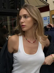 Lifestyle view of a woman wearing a colorful candy beaded necklace and bracelet set.