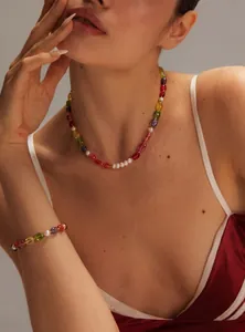 Close-up of vibrant candy-colored pearl and crystal beaded necklace and bracelet set