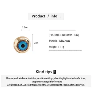 Macro detail of creative evil eye resin ring with size markings and alloy material info.