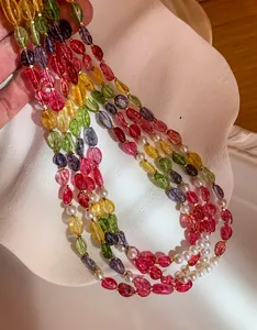 Detail of colorful dopamine crystal beads and pearl necklace with vibrant candy colors.