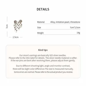 Detailed view of panther earrings with pearls, rhinestones, and measurement specs.