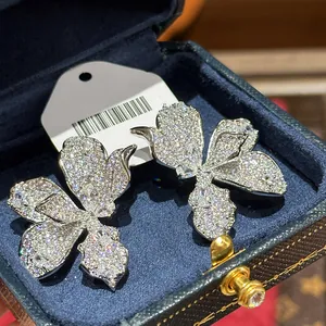 Elegant sparkling silver flower stud earrings with full zircon inlay in a velvet box
