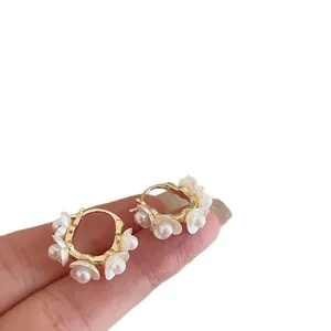 Elegant French style pearl flower hoop earrings with a gold finish