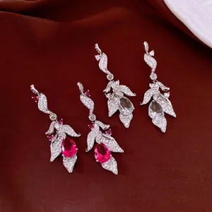 Elegant vintage leaf earrings with teardrop zircons in red and clear