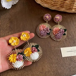 Elegant large fabric flower earrings with golden sunburst frame for beach holiday vacations