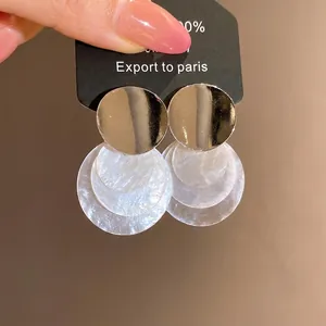 Minimalist silver stud earrings with layered shell round pendants for elegant women
