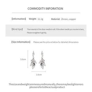 Detail view of vintage leaf drop earrings with zircon showing dimensions and weight info.