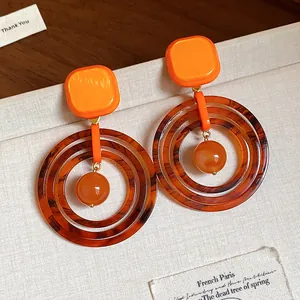 Retro geometric resin drop earrings with orange square studs and tortoiseshell hoops