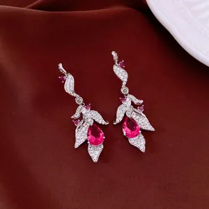 Elegant vintage silver needle leaf earrings featuring stunning red teardrop zircons