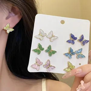 Twelve-piece set of colorful butterfly enamel stud earrings featuring dainty designs