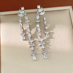 Detailed view of elegant silver-plated sparkling cubic zirconia tassel drop earrings