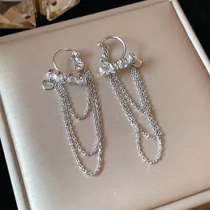Elegant silver zircon tassel ear clips with dangling long chains and heart charms