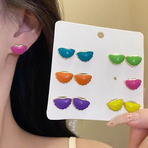 Close-up of 12-piece colorful enamel starfish butterfly stud earrings set on card