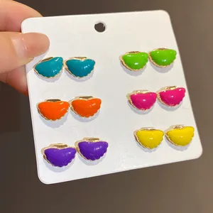Close-up of colorful 12-piece enamel shell stud earring set in vibrant summer holiday hues