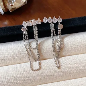 Elegant 1314 zircon tassel clip-on earrings for non-pierced ears in silver tone finish.