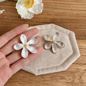 Elegant French style silver flower stud earrings for women with textured petals