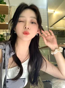 Close-up of model wearing stylish Korean-style zircon star earrings in silver finish