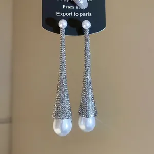 Elegant long dangling earrings with sparkling rhinestones and teardrop pearls for women