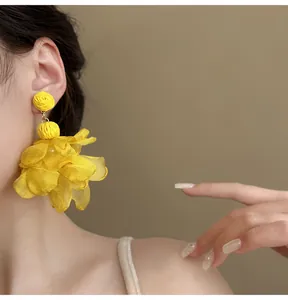 Oversized yellow chiffon flower petal dangle earrings for Bohemian beach vacation look