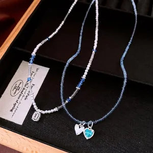 Elegant colorful beaded necklace set with heart and crystal pendants in dopamine style