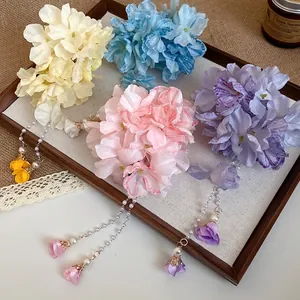 Romantic Bohemian fabric flower hair clips with pearl tassel dangles in pastel colors