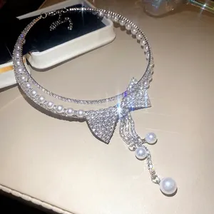 Elegant multi-layer choker necklace with sparkling rhinestone bow and pearl tassels