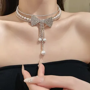 Close-up of an elegant multi-layer pearl and rhinestone bow choker for evening wear