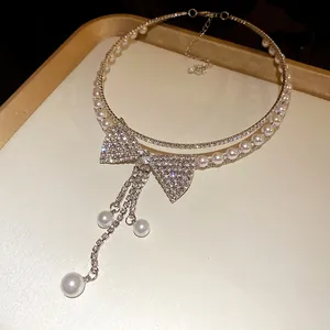Elegant multi-layer choker necklace with a sparkling rhinestone bow and pearls