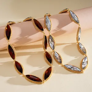 Close-up of heavy luxury necklace with marquise-cut crystals in gold-toned setting
