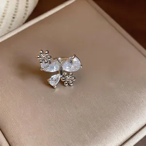 Macro detail of elegant zircon butterfly and flower ear clip for non-pierced ears