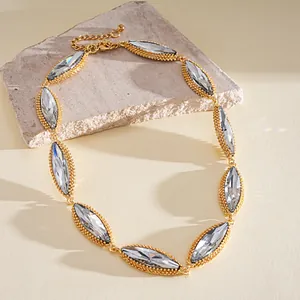 Detailed close-up of a luxury marquise-cut crystal necklace on a textured stone riser