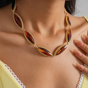 Detailed close-up of amber gemstone geometric choker necklace on model