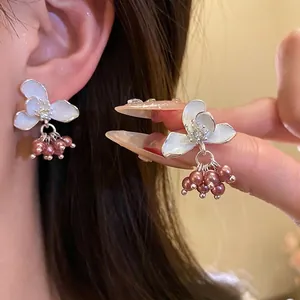 Elegant silver needle white flower stud earrings with dangling mauve pearls for women