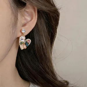 Vintage gold-plated heart shaped drop earrings with colorful gemstones and white pearls
