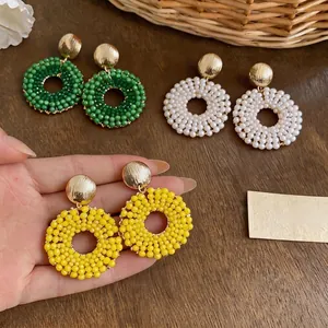 Elegant handmade glass beaded circular hoop earrings in green yellow and white colors