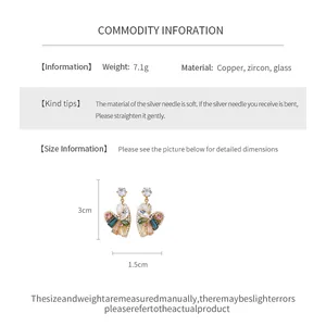 Detail view of vintage ethnic drop earrings with 3cm height and 1.5cm width dimensions.