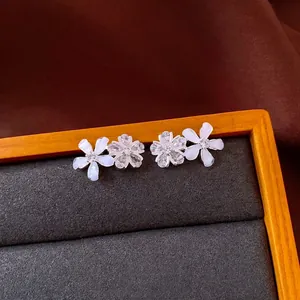 Elegant silver needle flower stud earrings with sparkling zircons and resin petals.