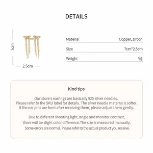 Detailed view of gold bow earrings with zircon and copper material specifications