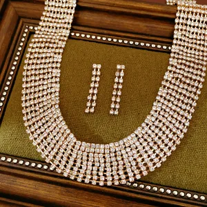 Detailed view of the sparkling rhinestone tassel necklace and earrings jewelry set