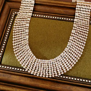 Close-up of elegant multi-row rhinestone choker necklace with rose gold setting