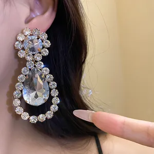 Elegant close-up of luxury silver needle rhinestone water drop dangle earrings for women