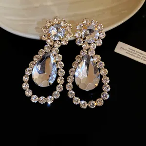 Close-up detail of these elegant rhinestone waterdrop dangling earrings with a silver needle.