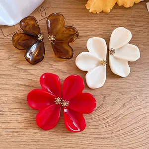 Elegant oversized resin flower stud earrings in red white and brown tortoiseshell