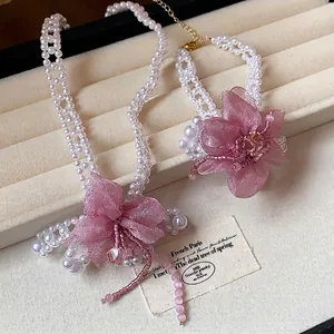 Elegant handmade jewelry set with pink chiffon flowers and white pearl beads for women