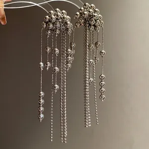 Minimalist silver-tone beaded tassel earrings featuring an elegant round cluster design